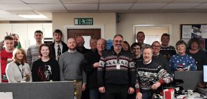 team with christmas jumpers on