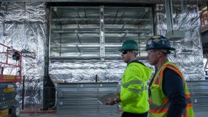 2 men in new project building