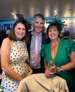 photo of 2 women and a man